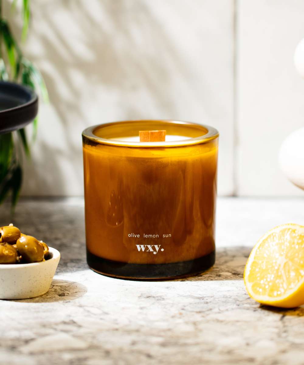Wxy. Roam Olive. Lemon. Sun. Candle with Pouch