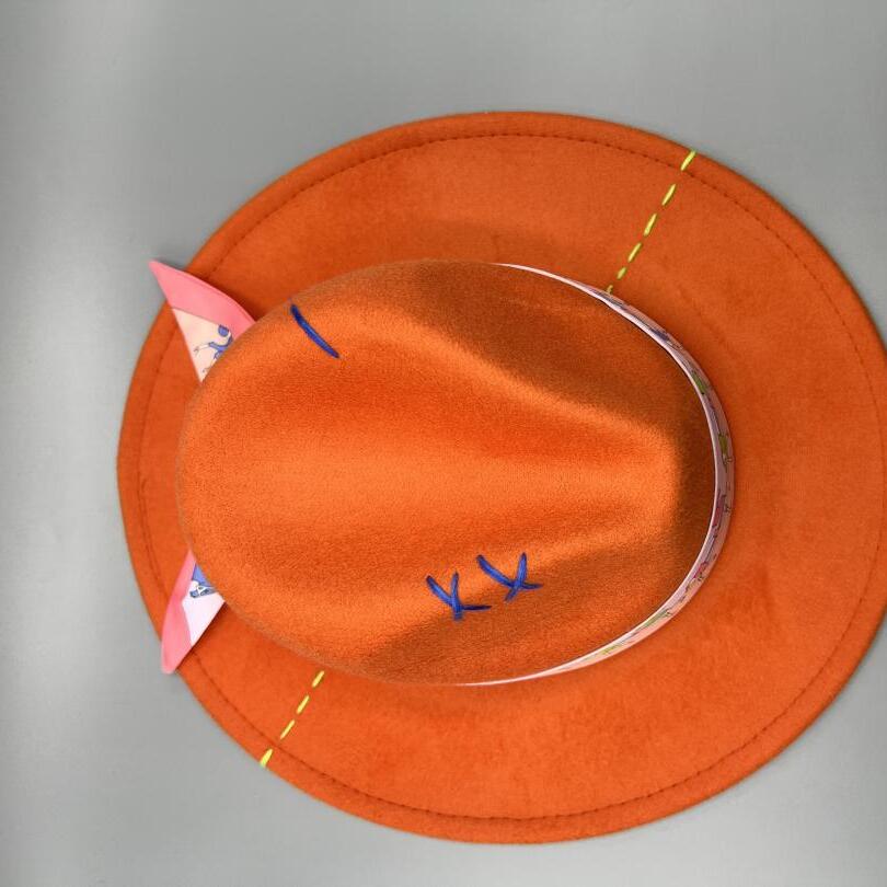 Orange fedora with yellow and blue stitches