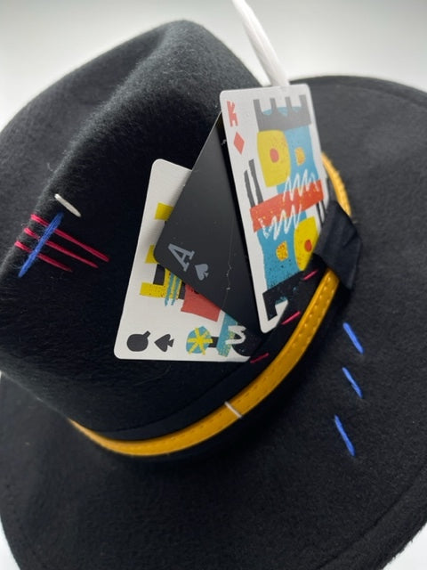 Black fedora with colorful cards