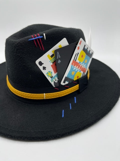 Black fedora with colorful cards