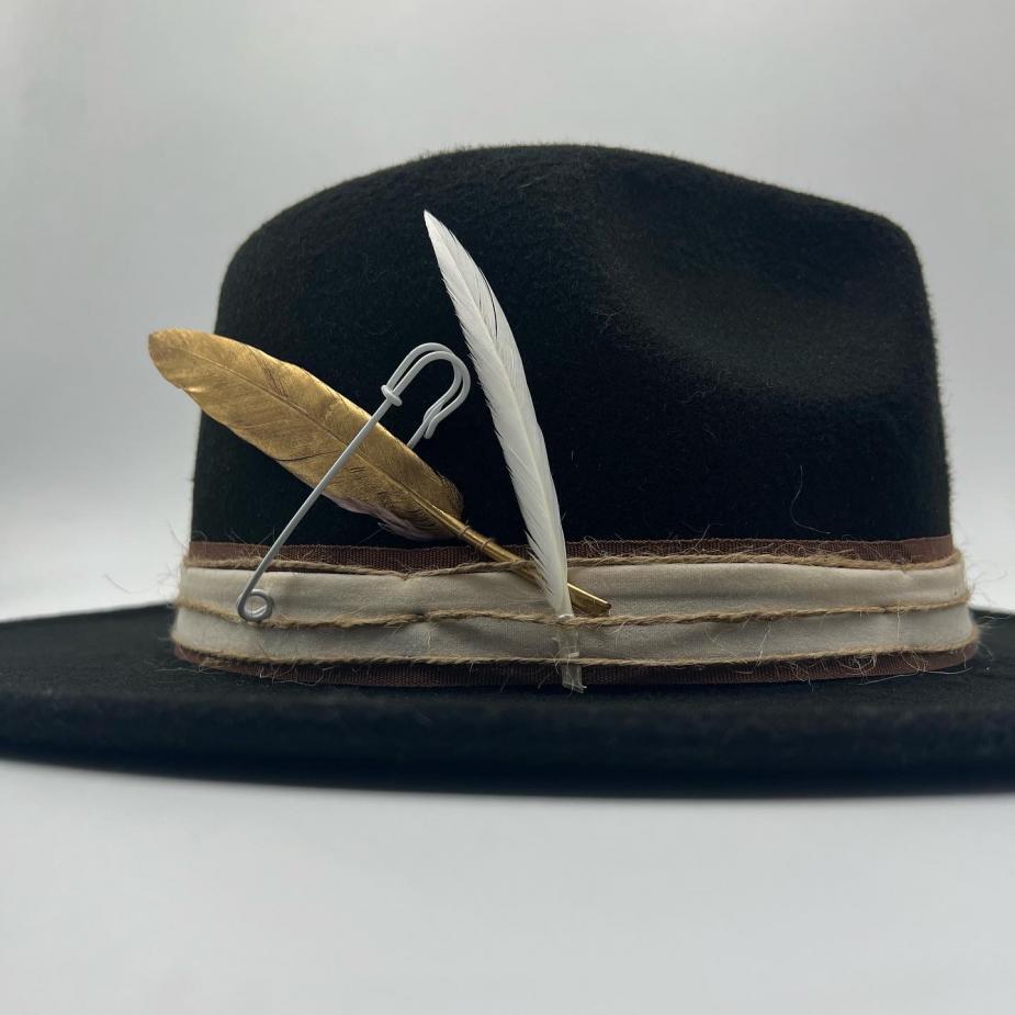Black fedora with gold feather