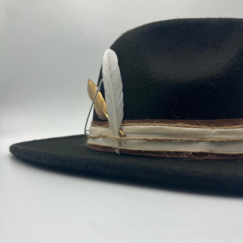 Black fedora with gold feather