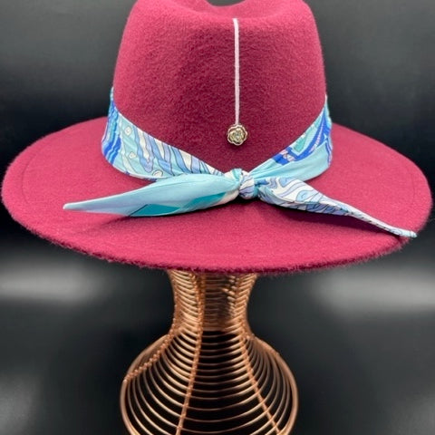 Burgundy fedora with flower accessory