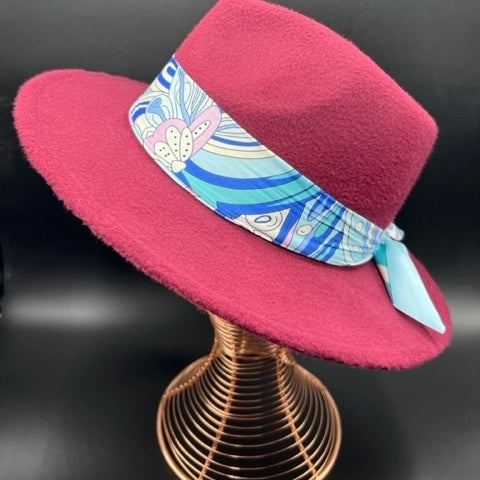 Burgundy fedora with flower accessory