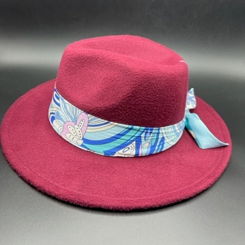 Burgundy fedora with flower accessory