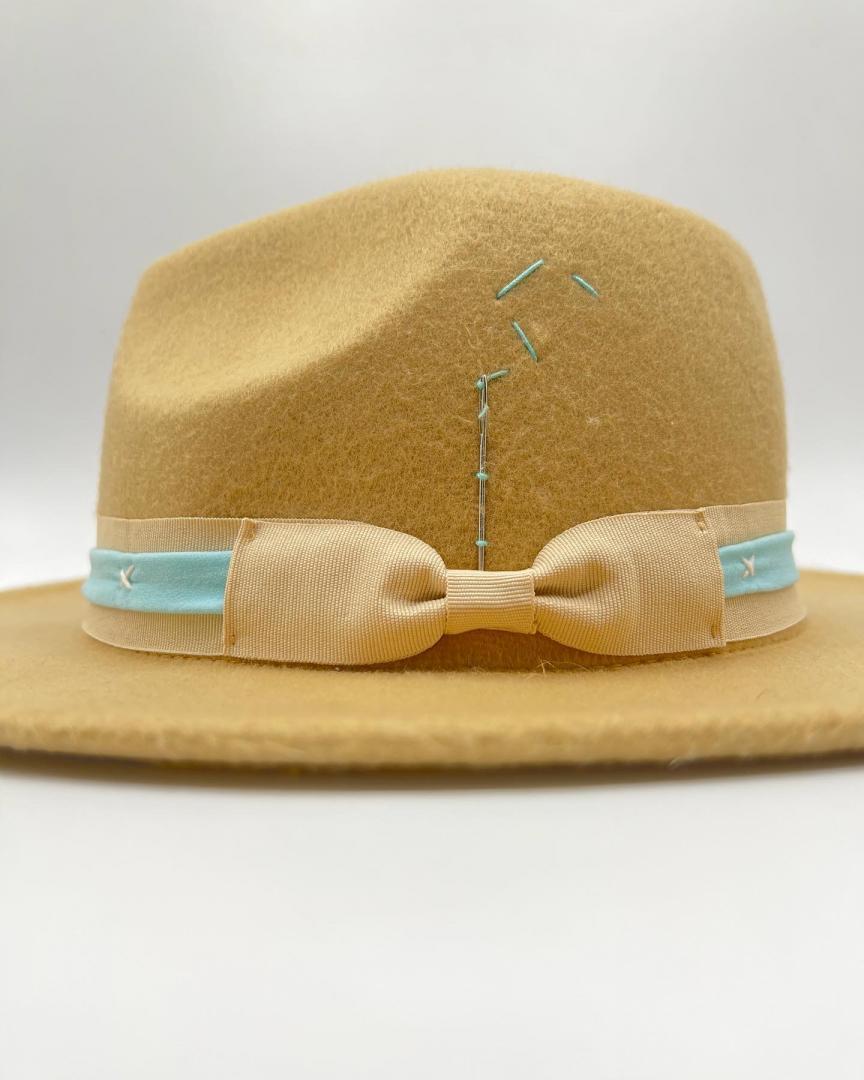 Cappuccino color fedora with baby blue strap