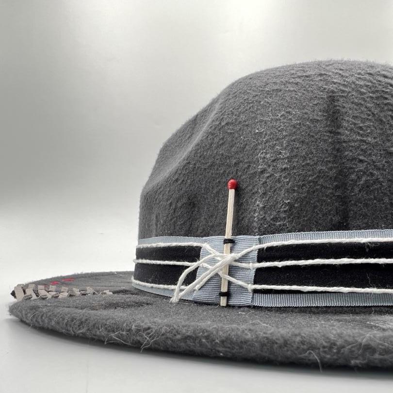 Grey fedora painted and cut