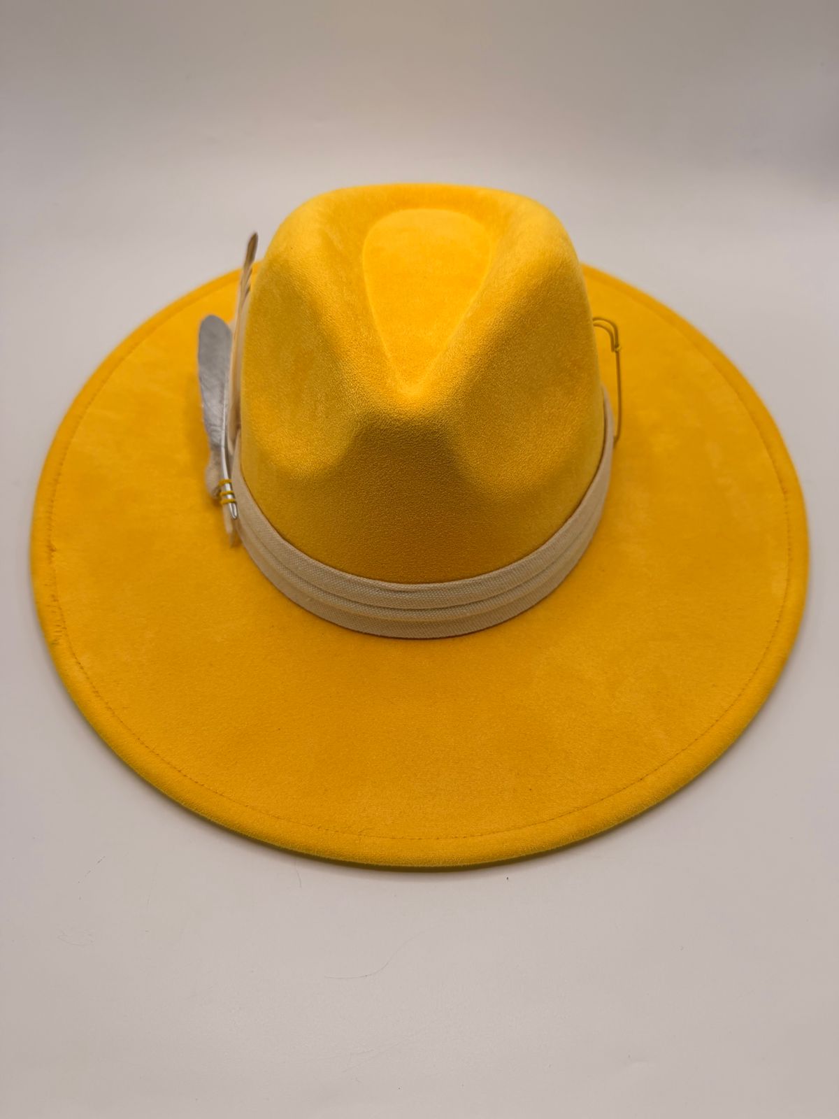 Yellow wide brim fedora with feathers