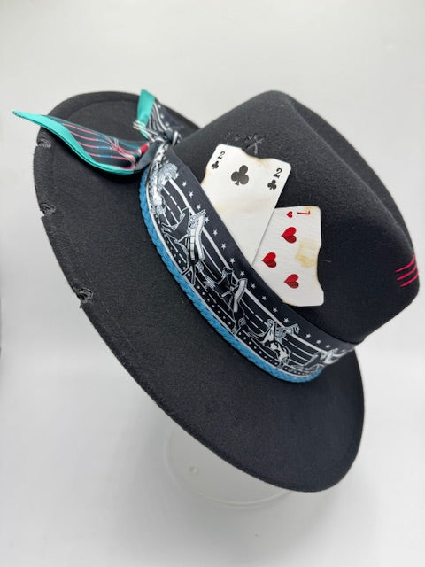 Black fedora with turquoise and red details