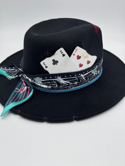 Black fedora with turquoise and red details
