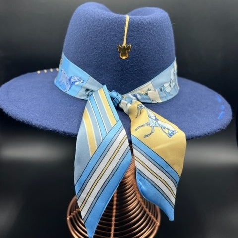 Navy blue fedora with angel accessory