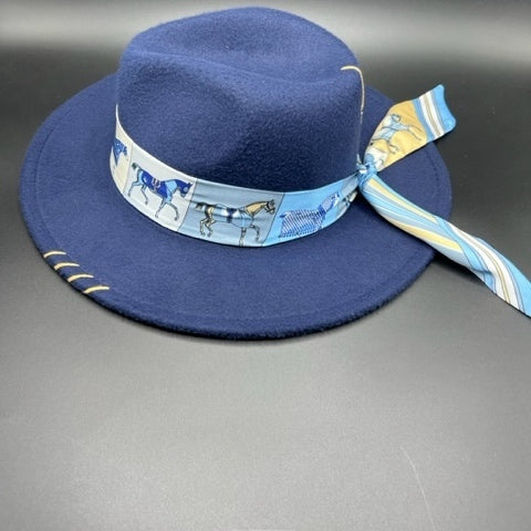 Navy blue fedora with angel accessory