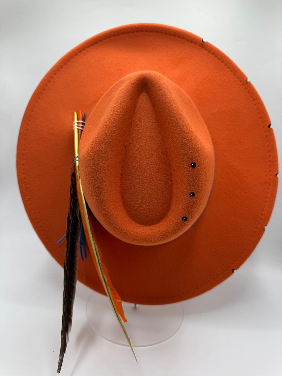 Orange wide brim fedora with blue details and feathers