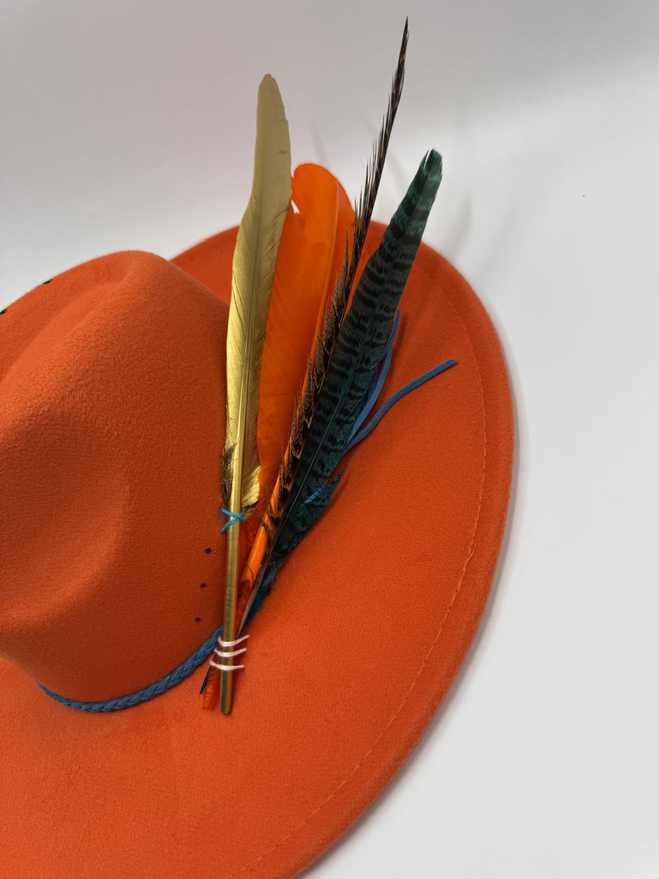 Orange wide brim fedora with blue details and feathers