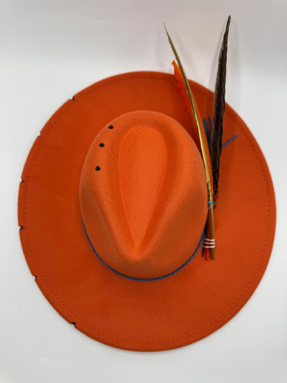 Orange wide brim fedora with blue details and feathers