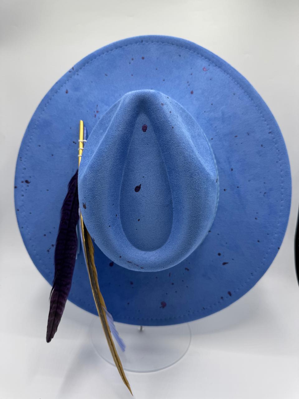 Wide brim blue fedora with splashes and feathers
