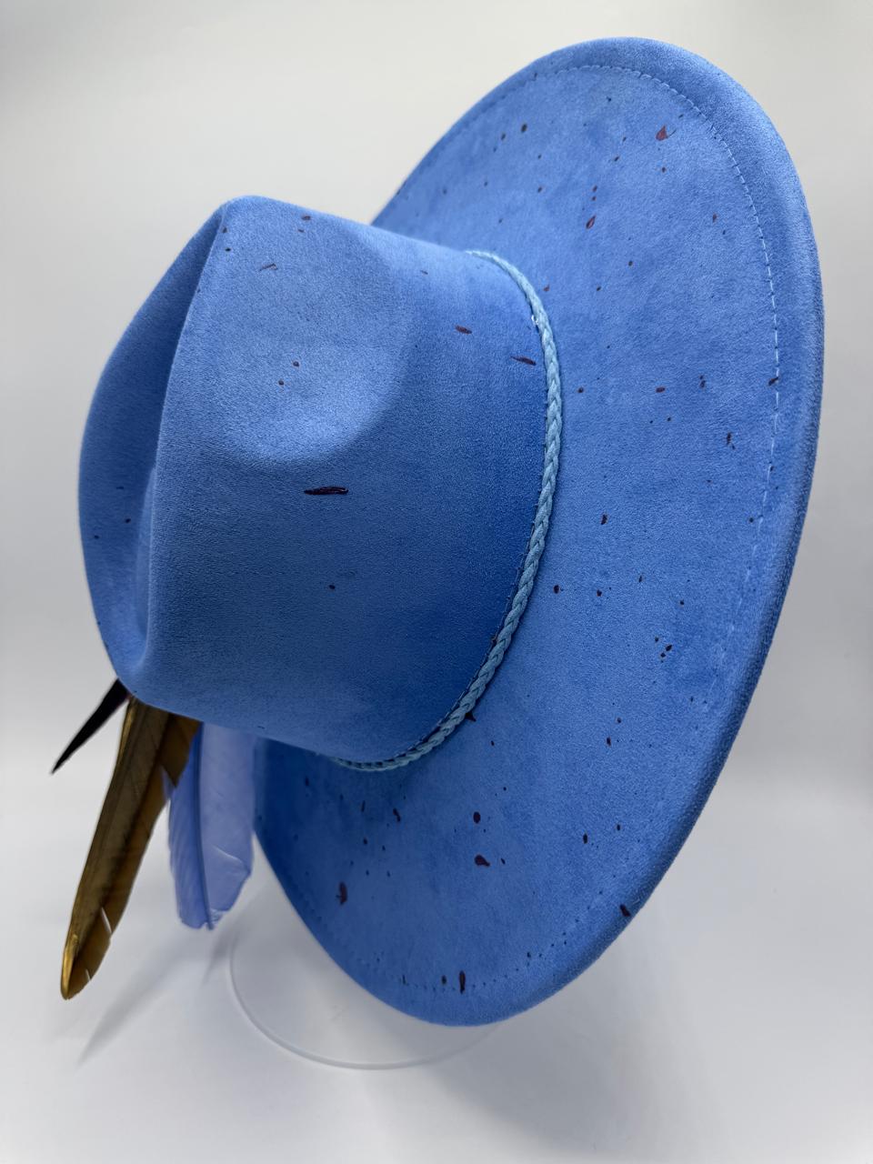 Wide brim blue fedora with splashes and feathers