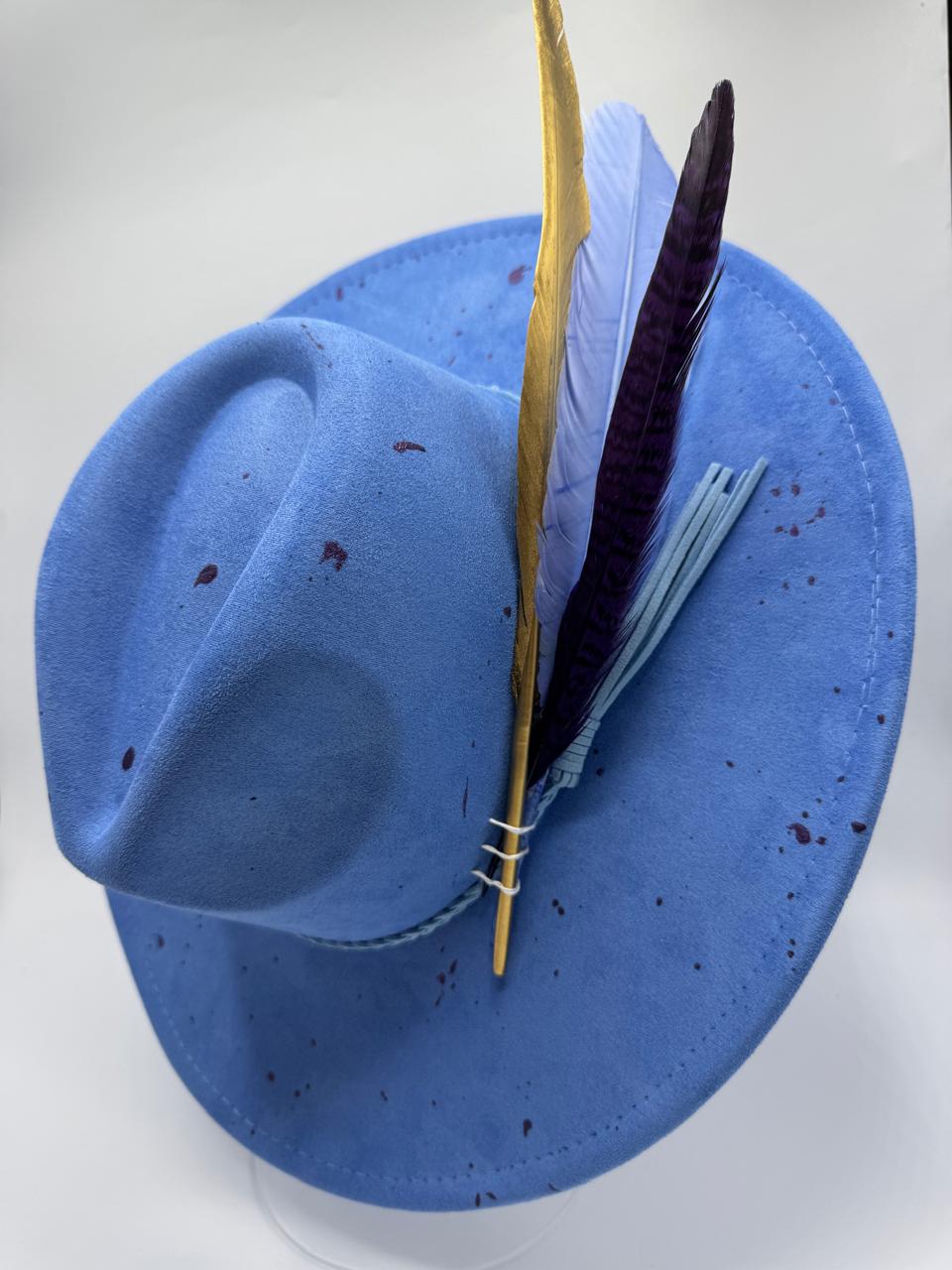 Wide brim blue fedora with splashes and feathers