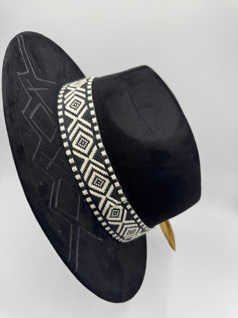 Black suede fedora with hand carving and gold feather