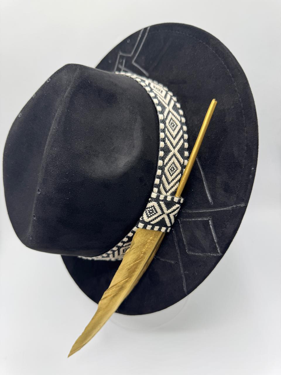 Black suede fedora with hand carving and gold feather