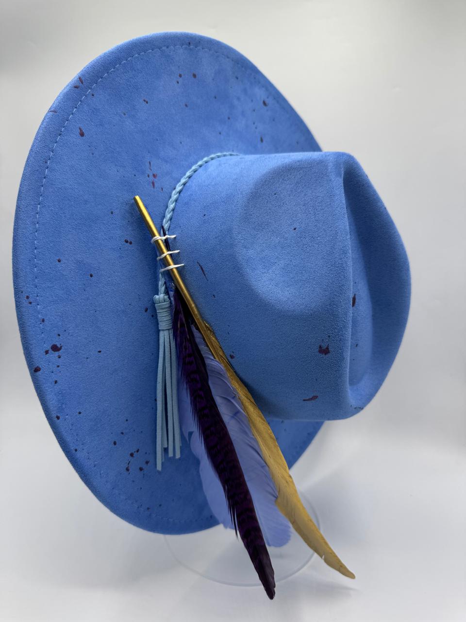 Wide brim blue fedora with splashes and feathers