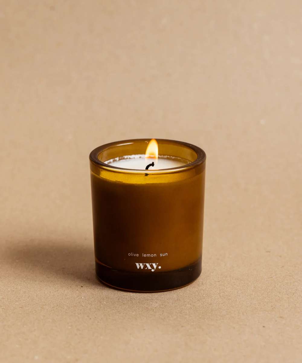Wxy. Roam  Olive. Lemon. Sun. Glass Candle