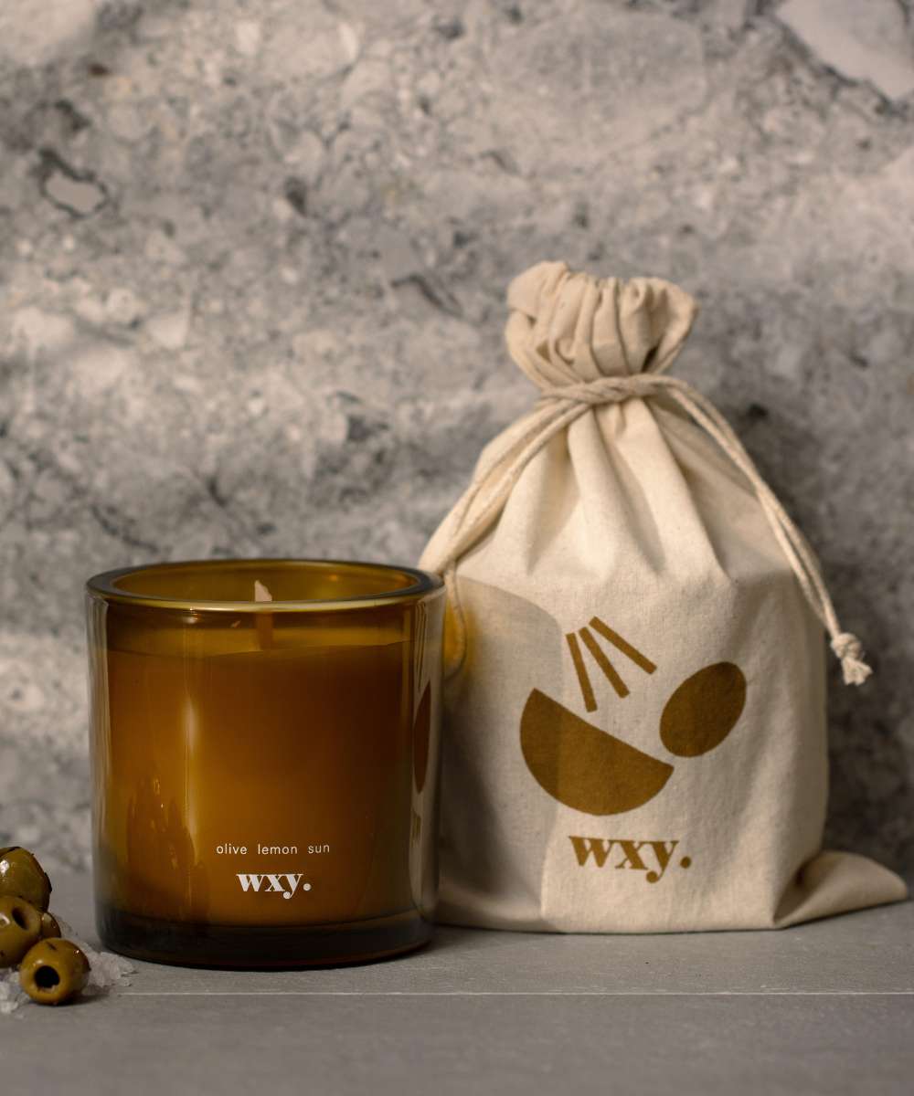 Wxy. Roam Olive. Lemon. Sun. Candle with Pouch