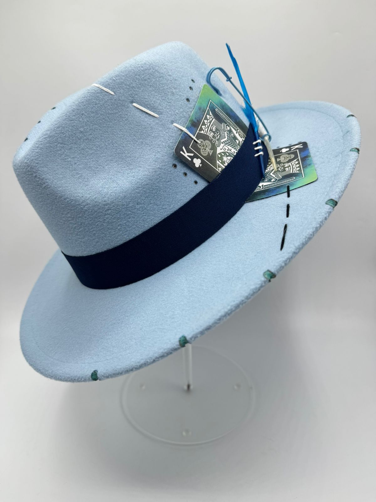 Baby blue fedora with cards and feathers