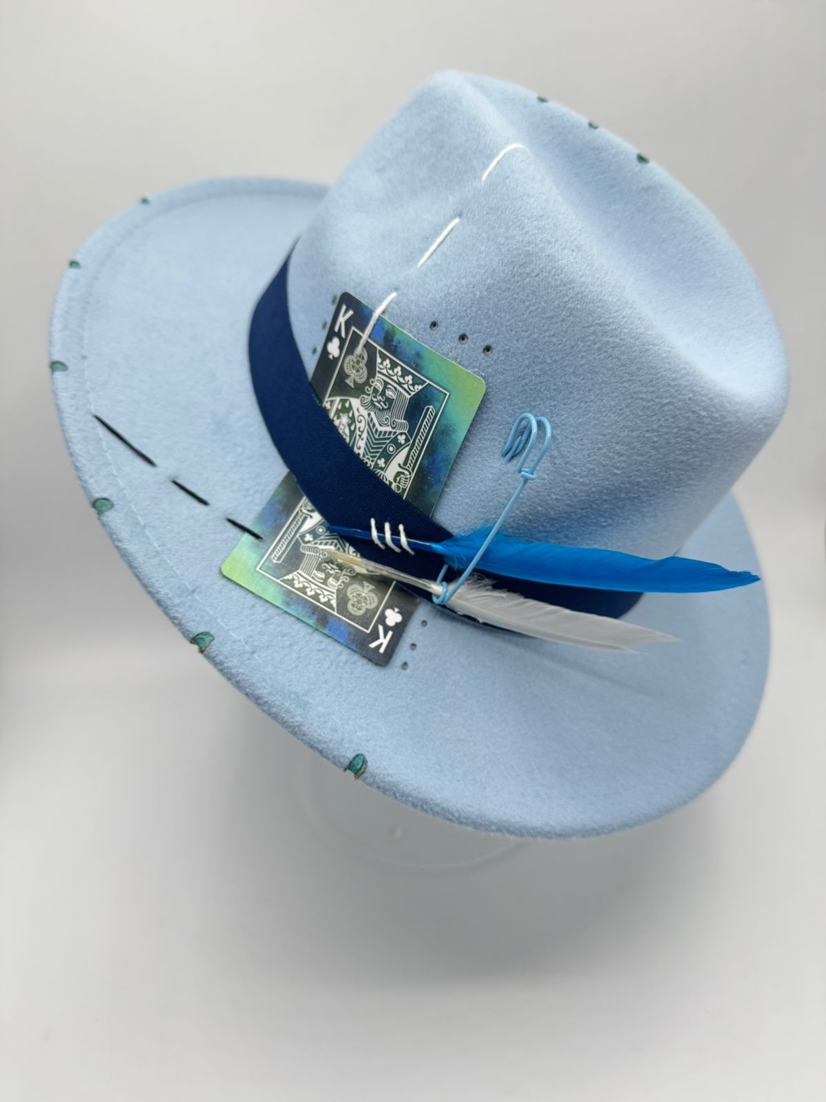 Baby blue fedora with cards and feathers