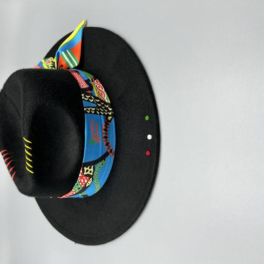 Black fedora with red and yellow stitches