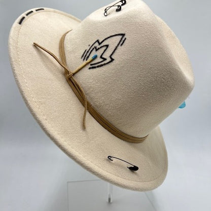 Beige hat with baby blue feather