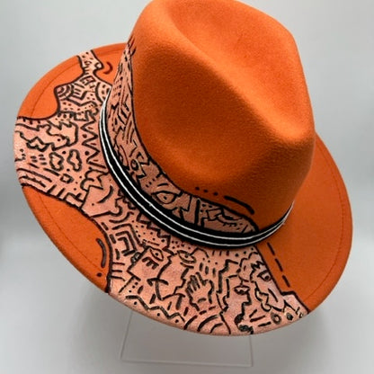 Orange fedora with hand drawing