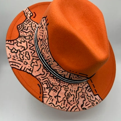 Orange fedora with hand drawing