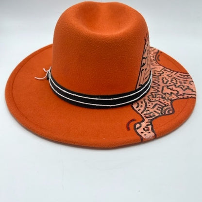 Orange fedora with hand drawing