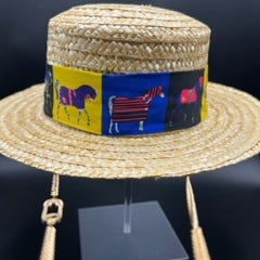 Natural straw boater with blue scarf and gold chain