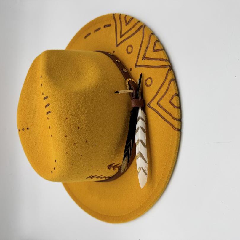 Mustard fedora with carving and feather