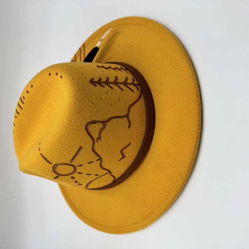 Mustard fedora with carving and feather