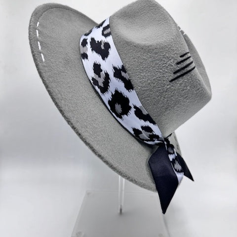 Grey fedora with animal print scarf