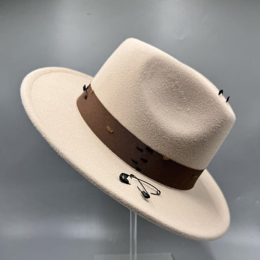 Beige fedora with safety pin