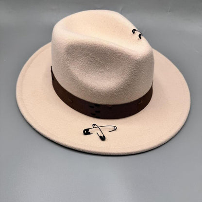 Beige fedora with safety pin