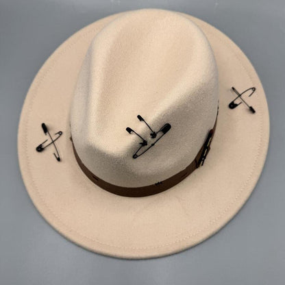 Beige fedora with safety pin