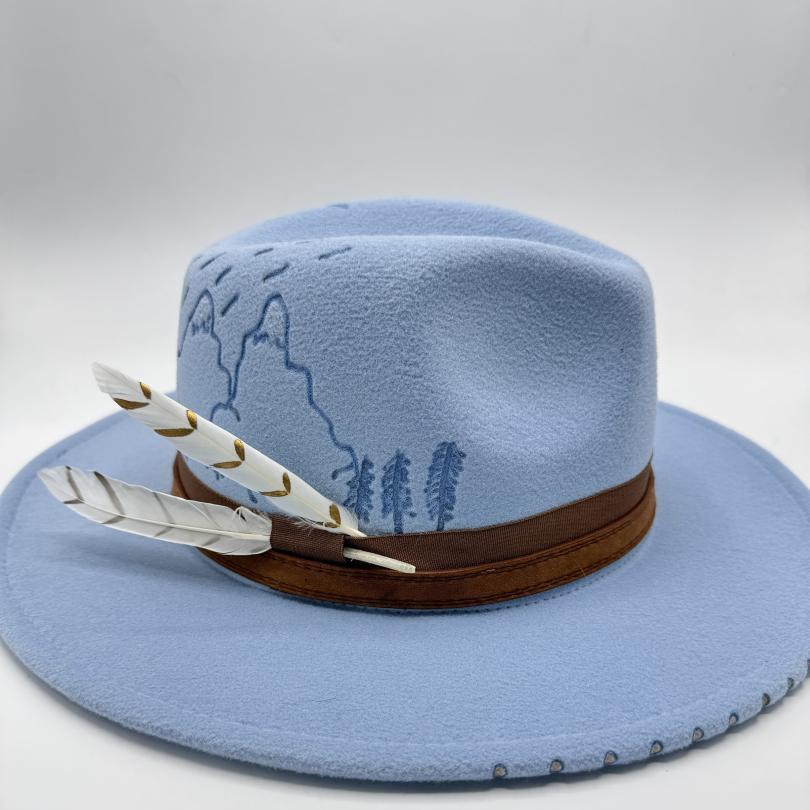 Blue fedora with carvings