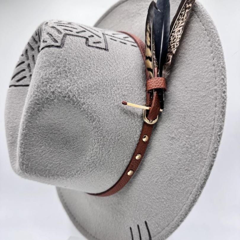 Grey fedora with carving and feathers