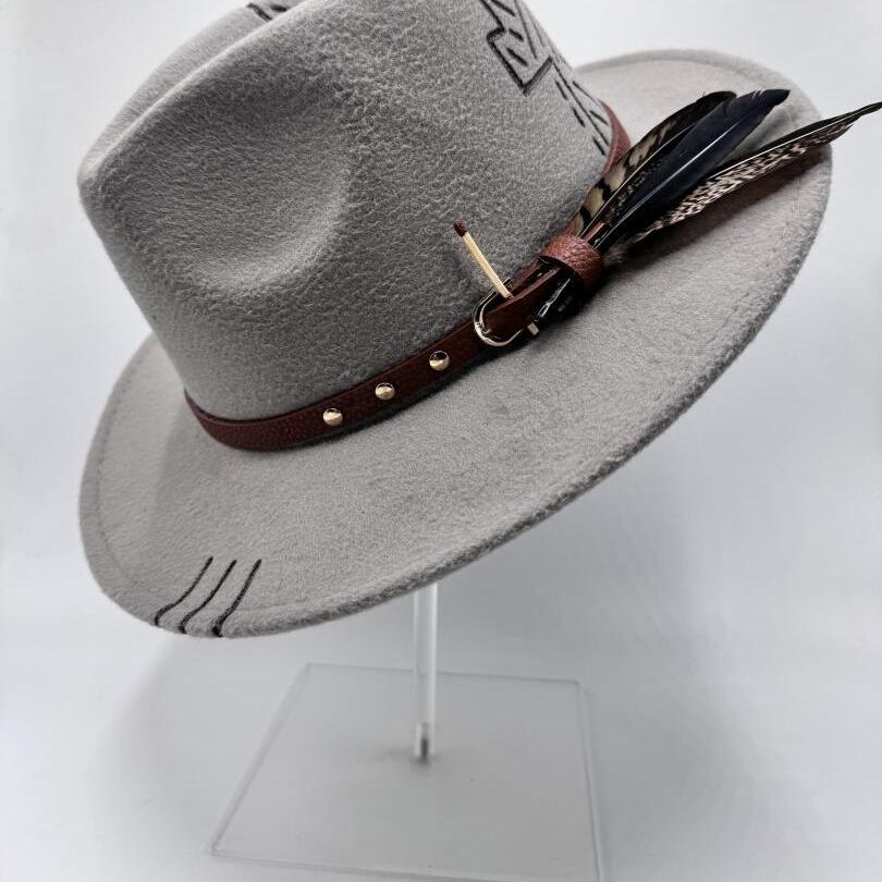 Grey fedora with carving and feathers