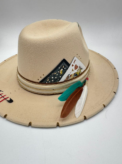 Beige fedora with cards and feathers