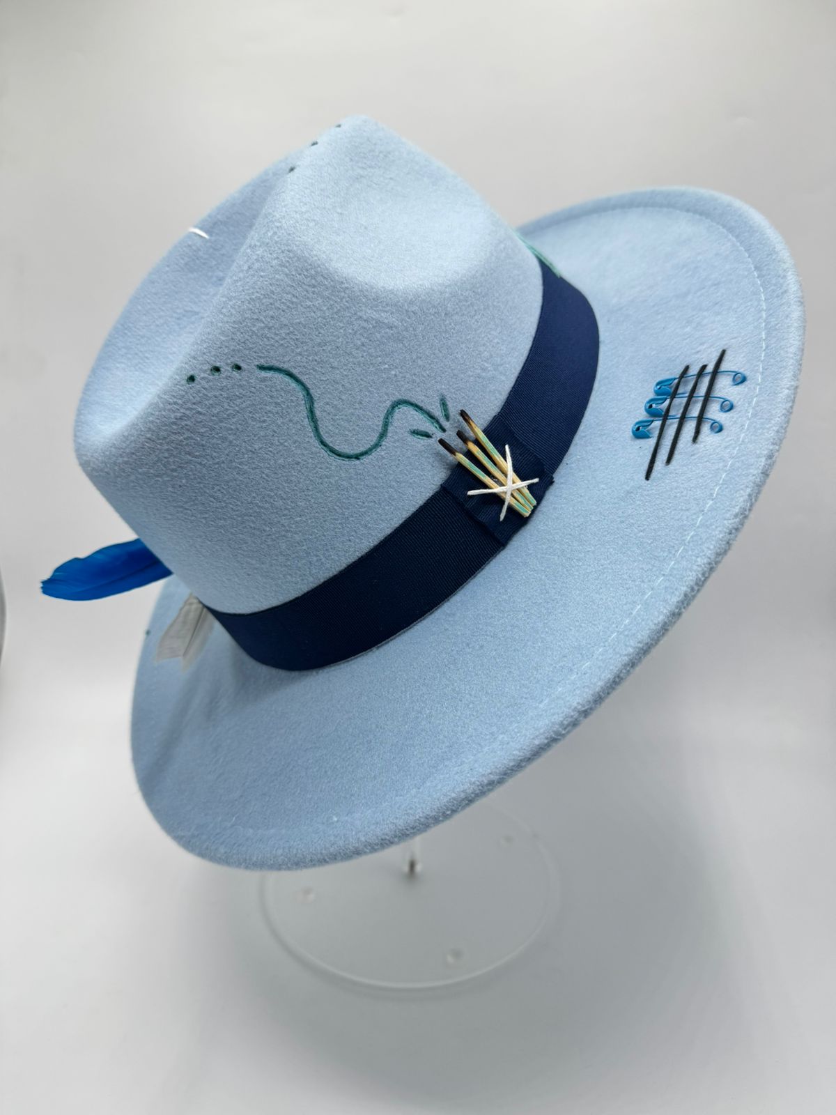 Baby blue fedora with cards and feathers