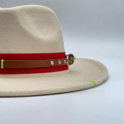 Beige fedora accessorized with tulip brooch