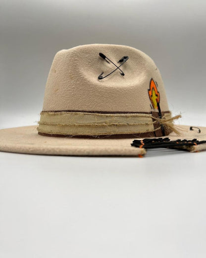 Beige fedora with golden card and golden feather