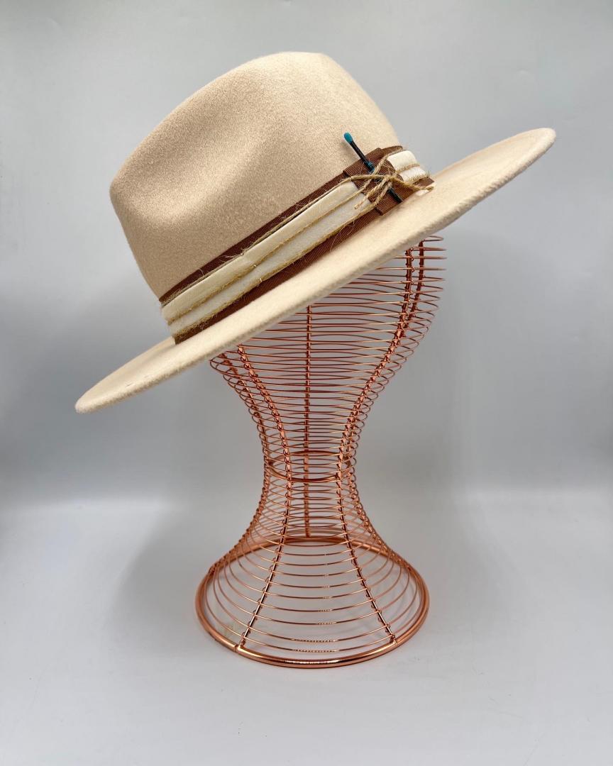 Beige fedora with golden feather