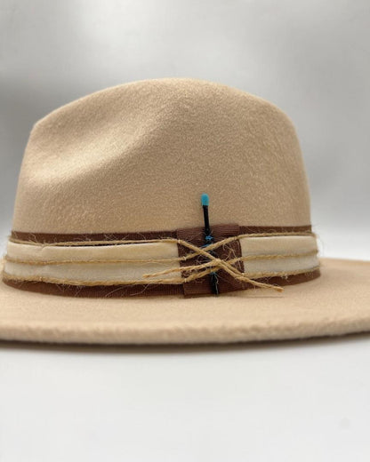 Beige hat with turquoise  feather